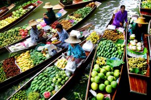 Fruit sellers along the canal of Damnoen Saduak Floating Market