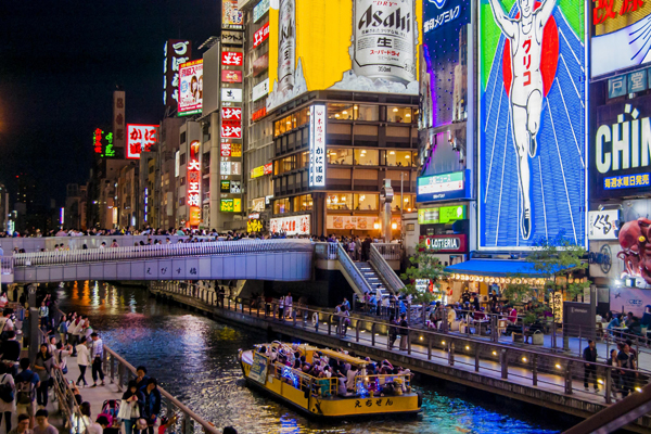 Bustling atmosphere of Dotonbori Shopping Street at night