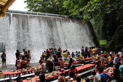 People having sumptuous buffet lunch at the Villa Escudero waterfall
