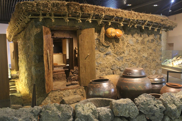 The old house where women lived and the hanging round ball-like tube with fishnet