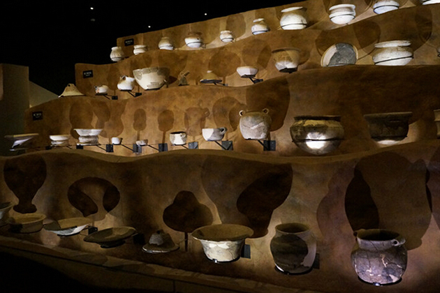 Pottery in Hemudu Site Museum casting beautiful shadows on walls