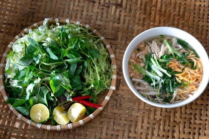 Bun thang noodle soup with chicken, pork cake, and egg