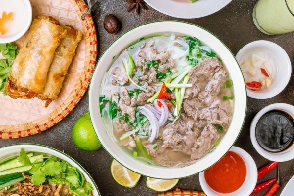 Vietnamese beef pho with fresh herbs