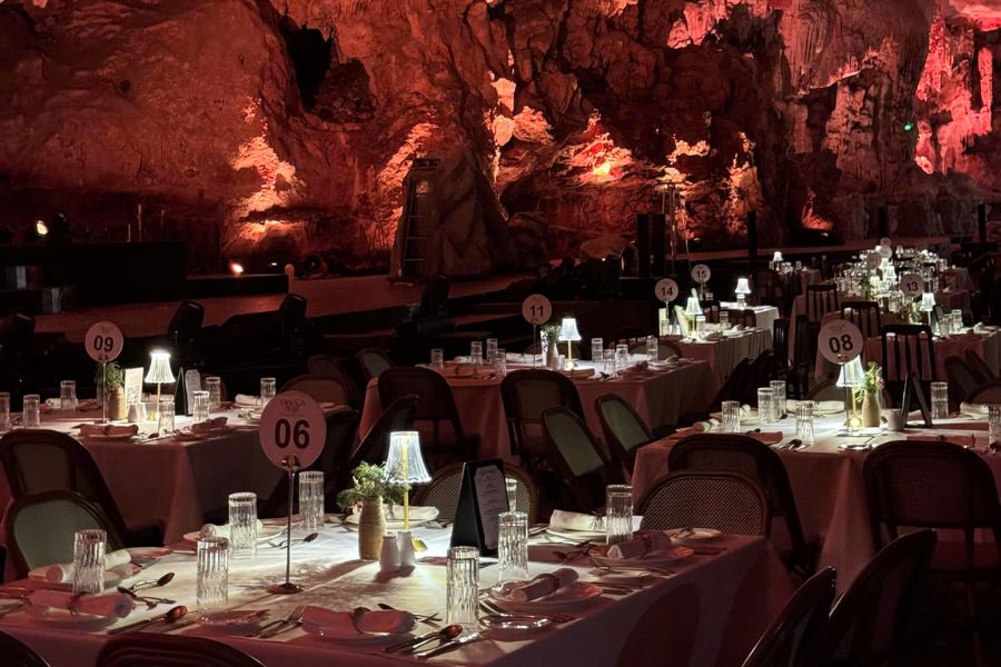 Dinner atmosphere inside Dragon Pearl Cave during evening performance