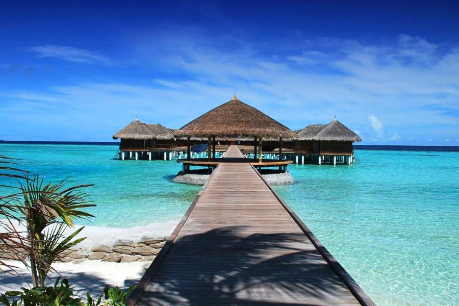 Clear turquoise lagoon and overwater villas in the Maldives