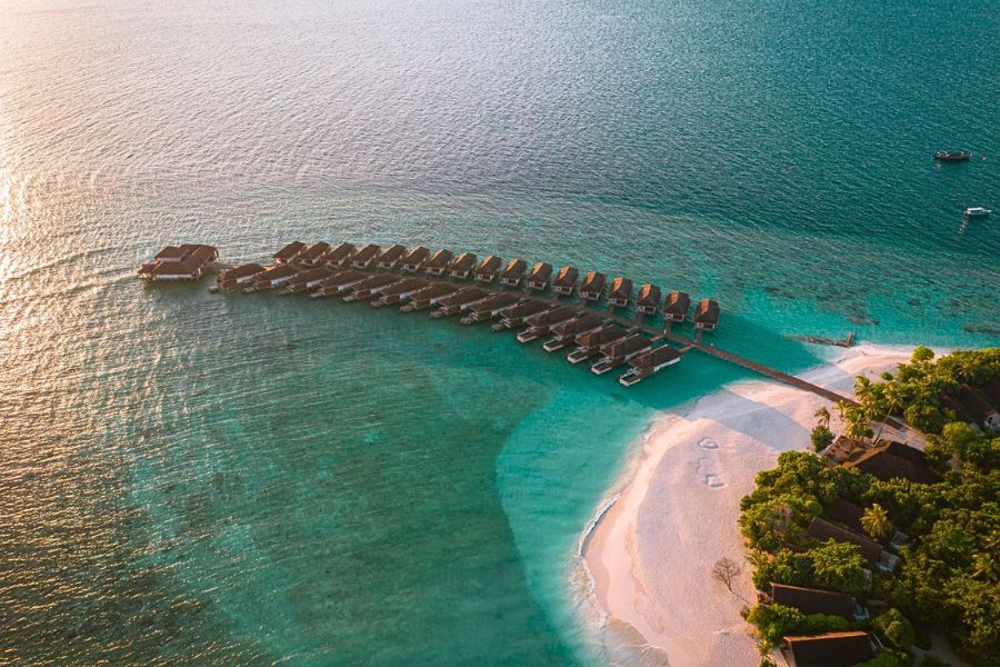 Maldives resort island at sunset