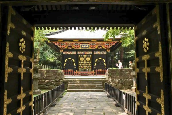Ornate Zuihoden Mausoleum surrounded by cedar trees