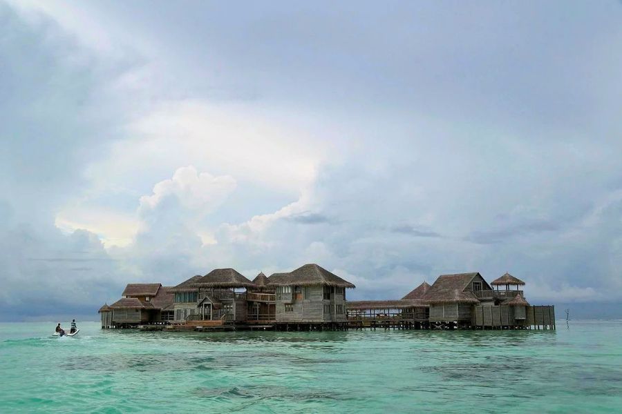 Rain clouds over Maldives overwater villas