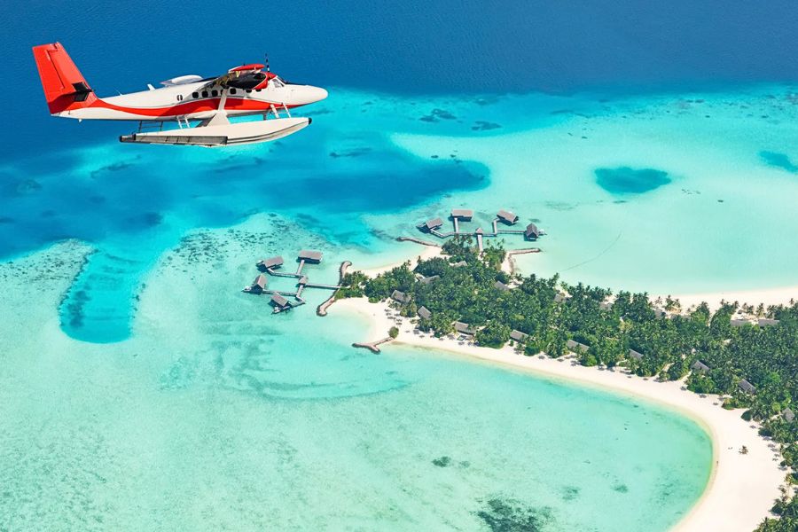 Seaplane over a Maldives island