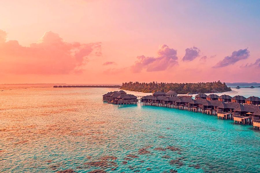 Sunset over Maldives overwater villas