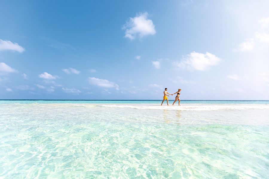 Walking in a shallow Maldives lagoon