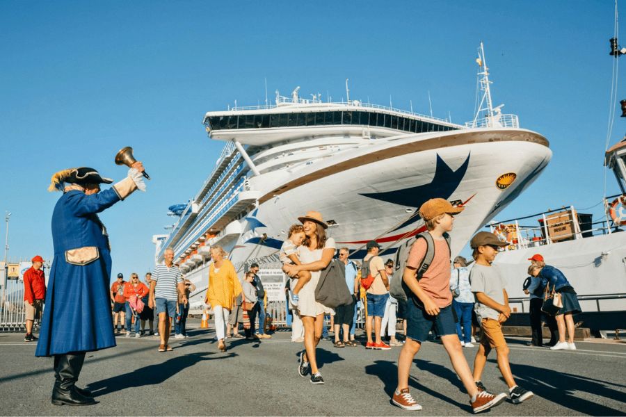 Cruise passengers boarding an excursion boat