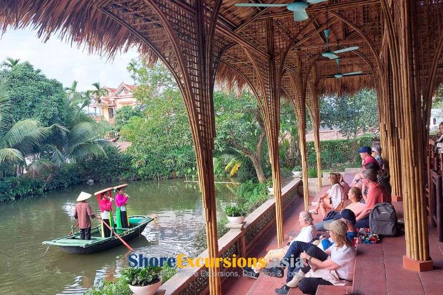 Guests enjoying a water puppet show in Yen Duc